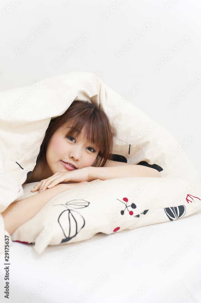 a portrait of beautiful asian woman on the bed