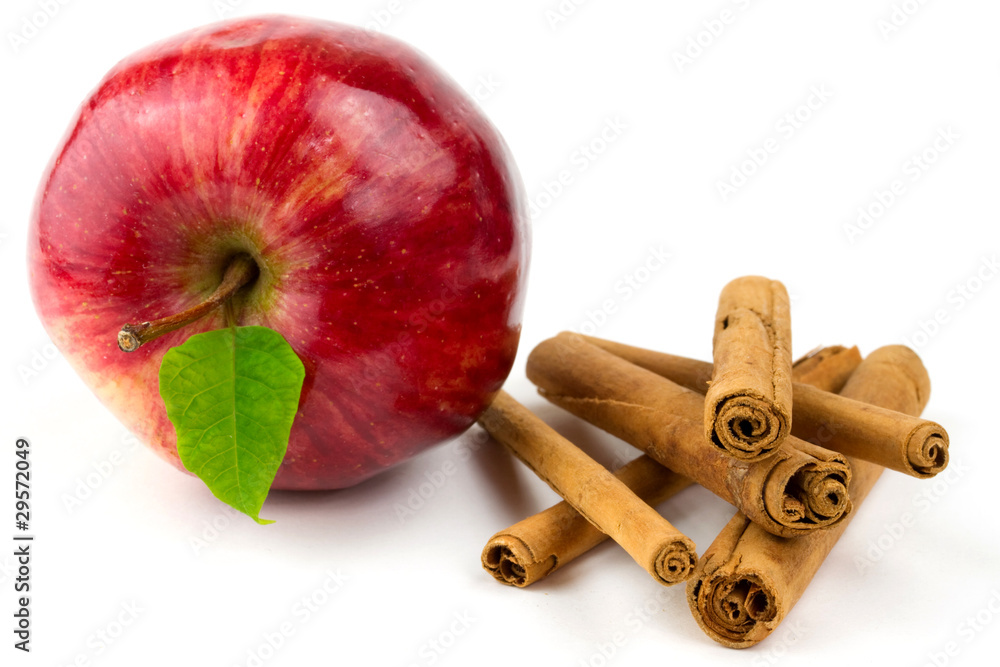 Apple and cinnamon sticks isolated on white