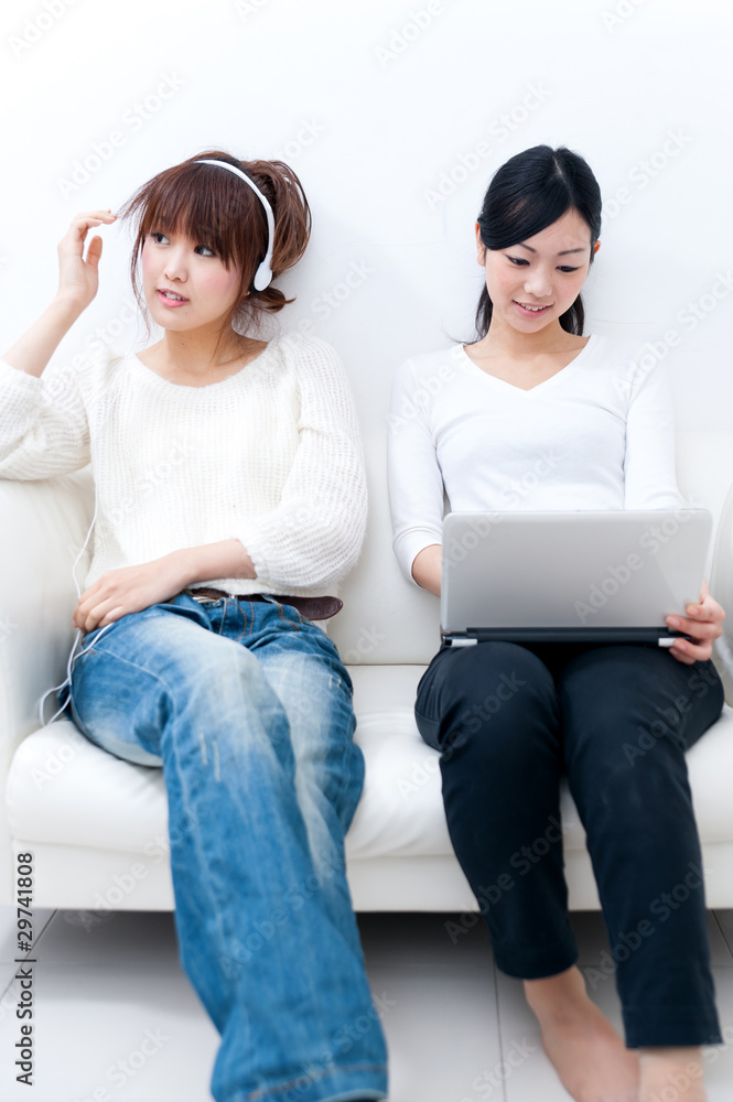 two beautiful asian women relaxing