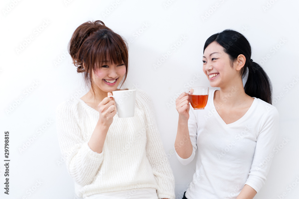 two beautiful asian women talking