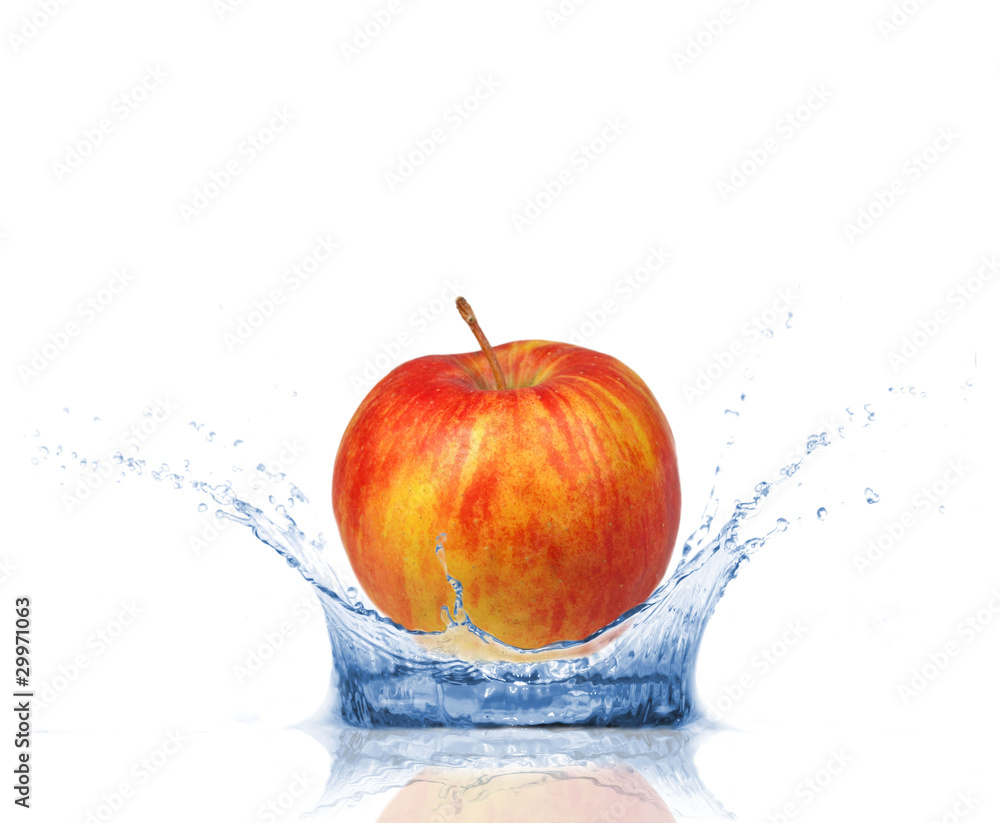 Fresh apple dropped into water