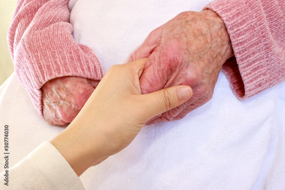 Old and Young Hands on White Blanket