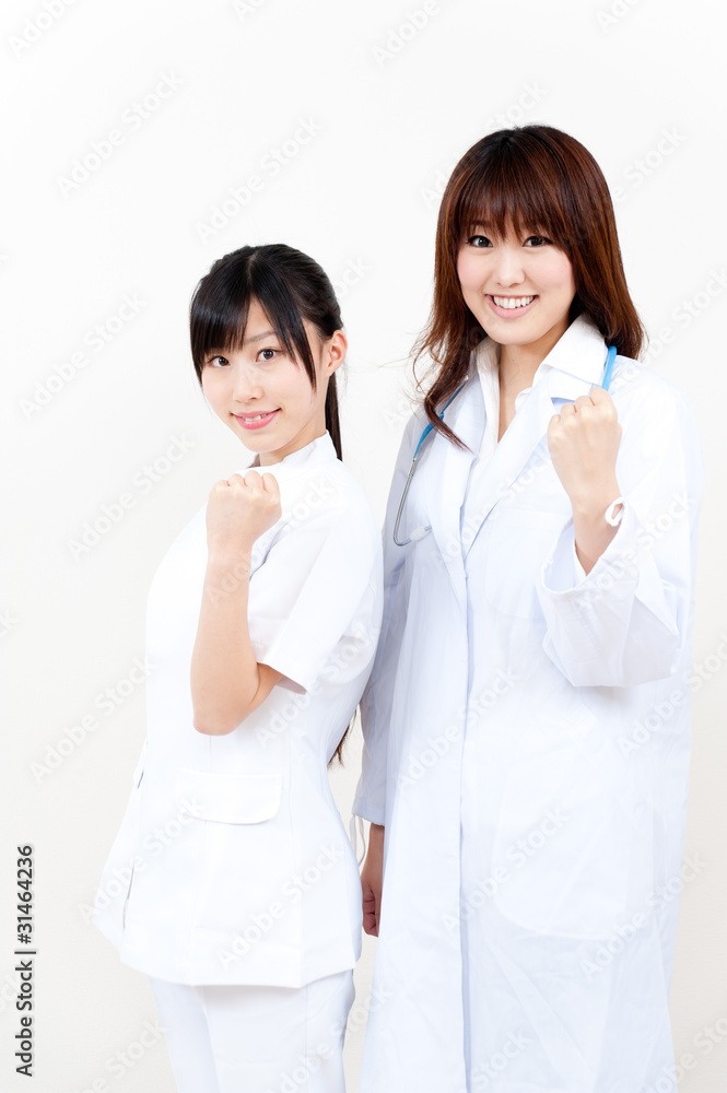 two beautiful asian doctors cheering