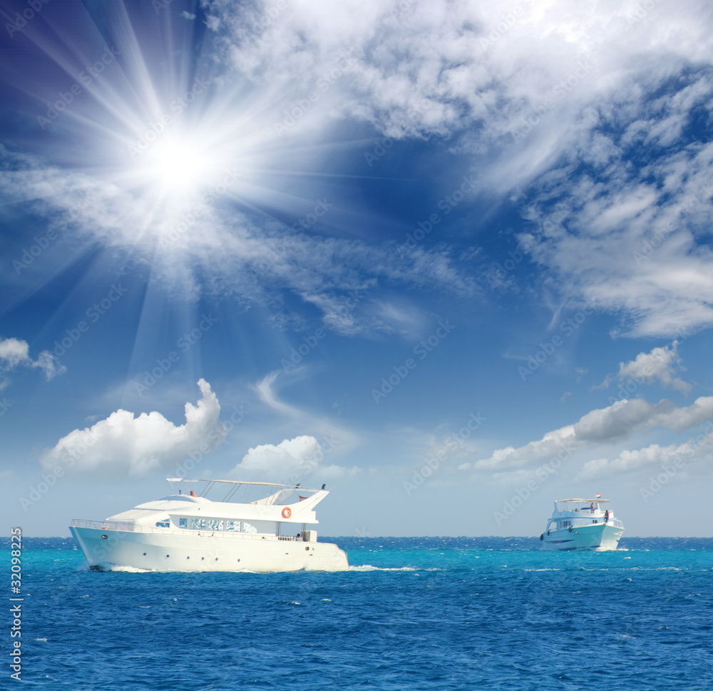 white boats sailing on turquoise sea