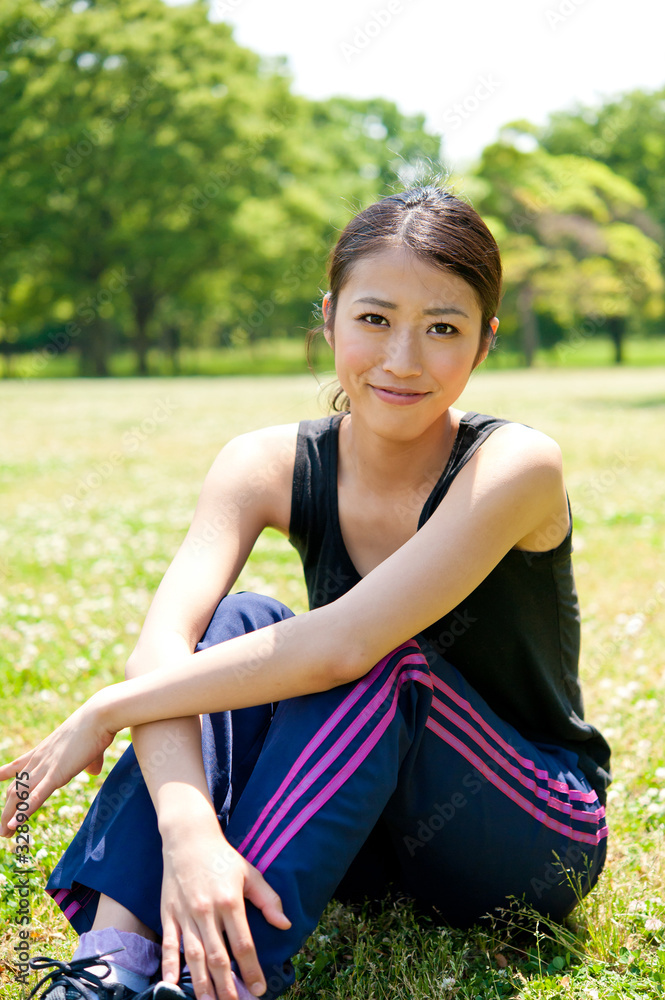 beautiful asian woman sitting in the park