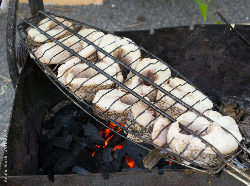 The baked fish. A shish kebab.