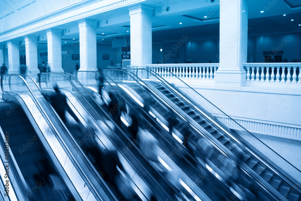 escalators with passenger motion blur