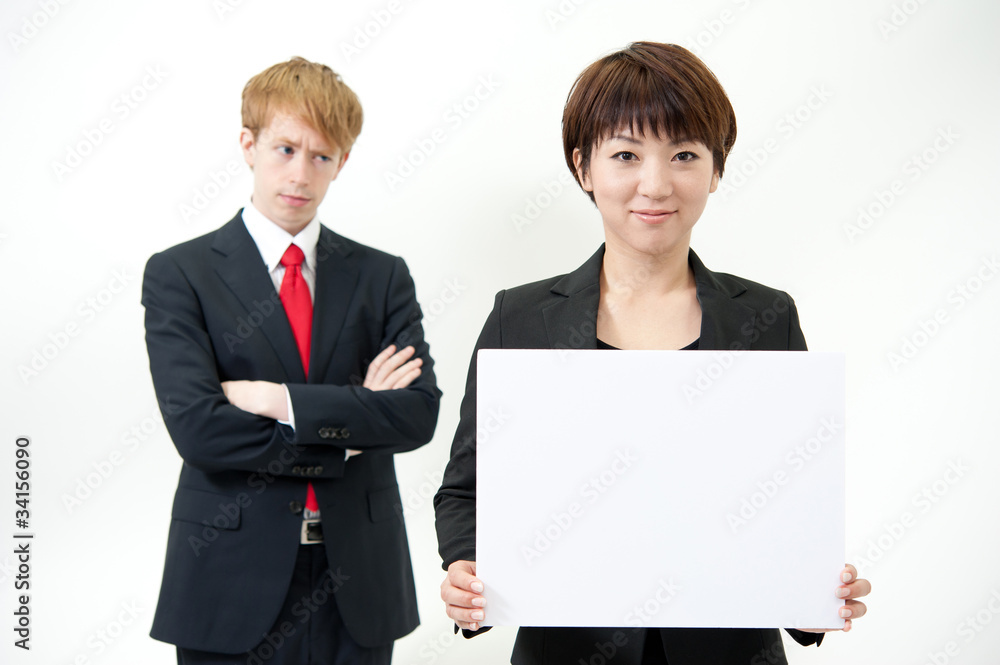 businessteam holding a blank whiteboard