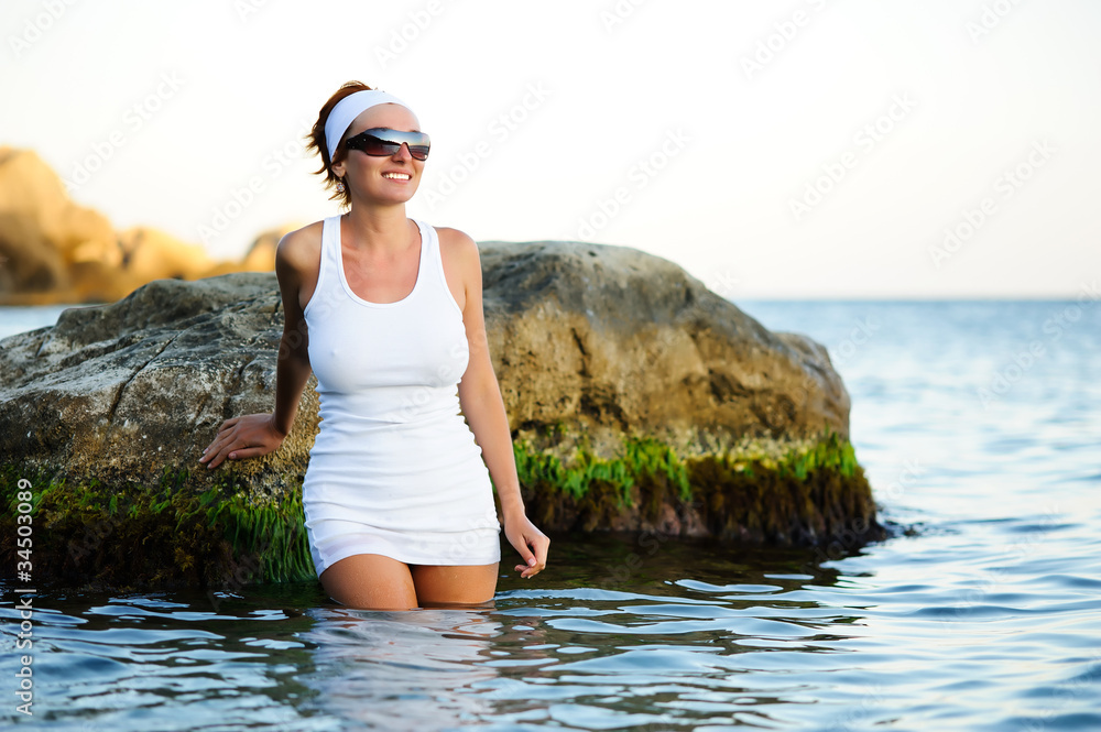 Beautiful woman splashing in the sea