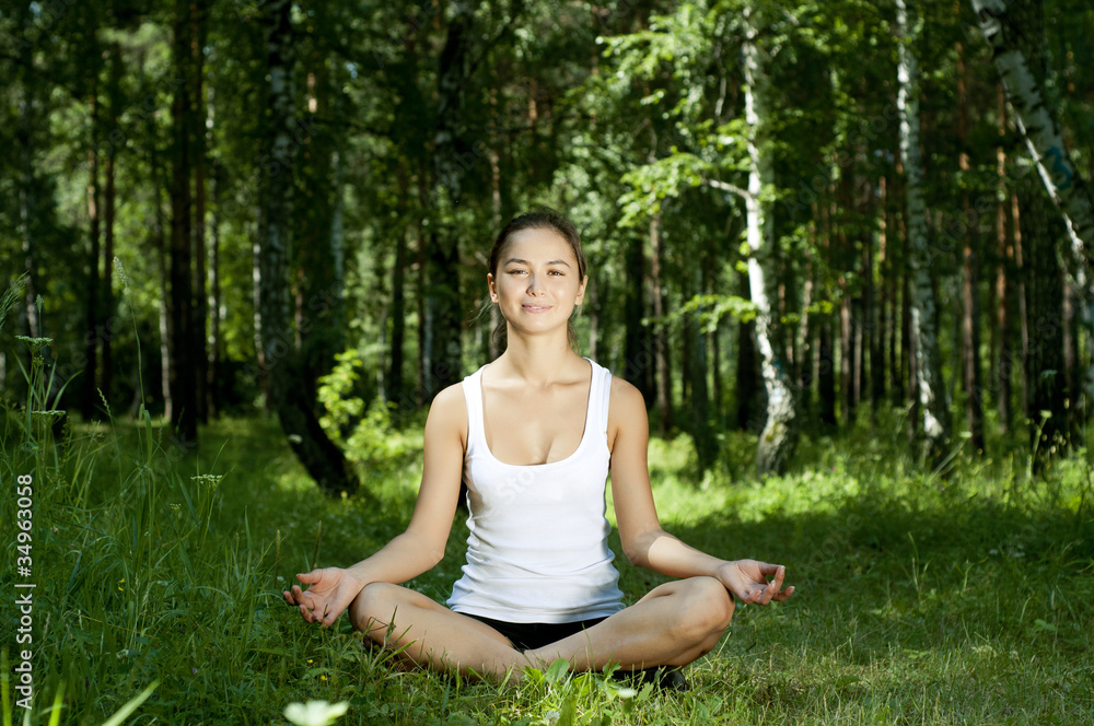 yoga woman on green grass