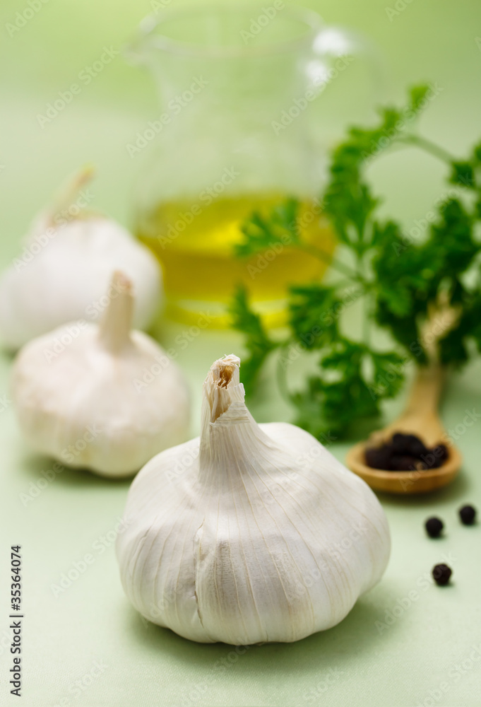 Garlic with peppercorn, parsley and olive oil