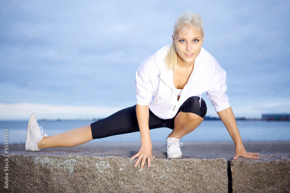 Beautiful woman doing stretching exercise