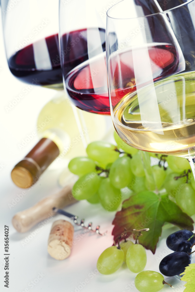 Glasses of white, red and rose wine and grapes