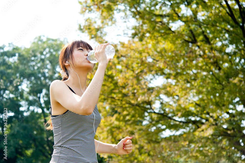 beautiful asian runnning in the park