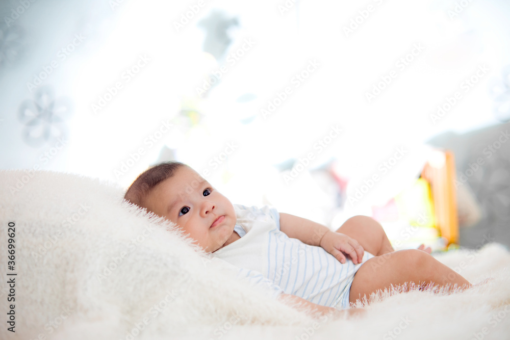 cute baby lie on bed