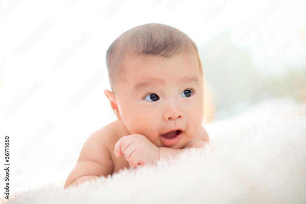 cute baby lie on bed