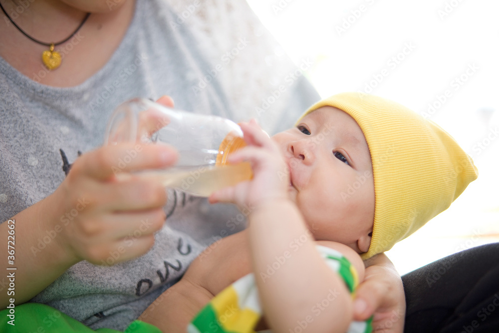 mother feed milk to baby