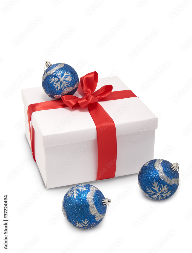 white box with red ribbon and Christmas decorations