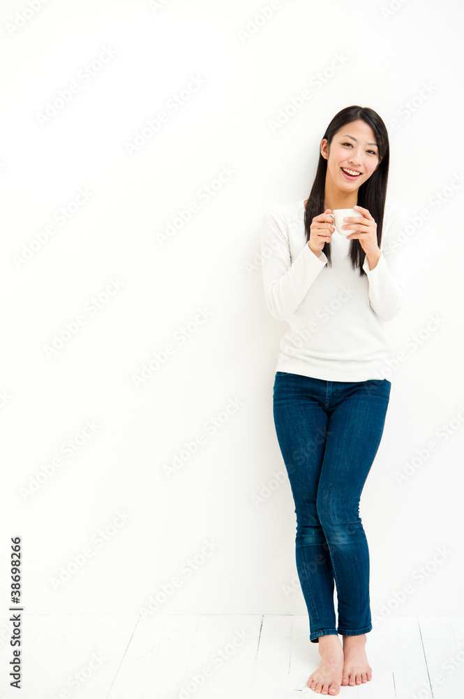 attractive asian woman relaxing in the white room