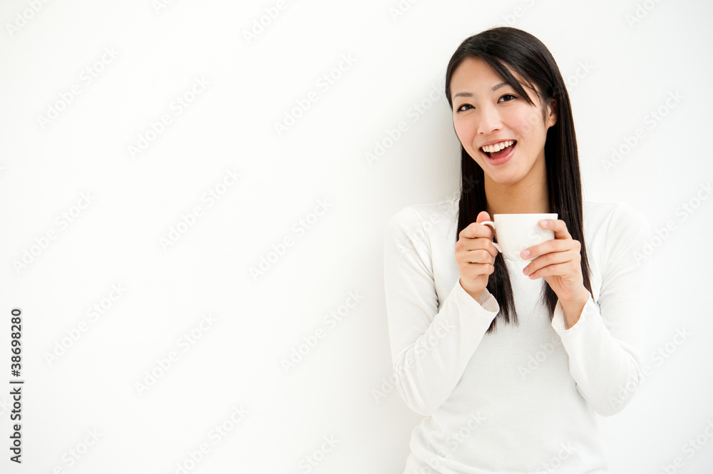 attractive asian woman relaxing in the white room