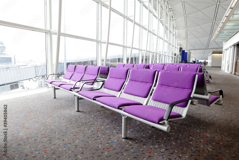 row of purple chair at airport