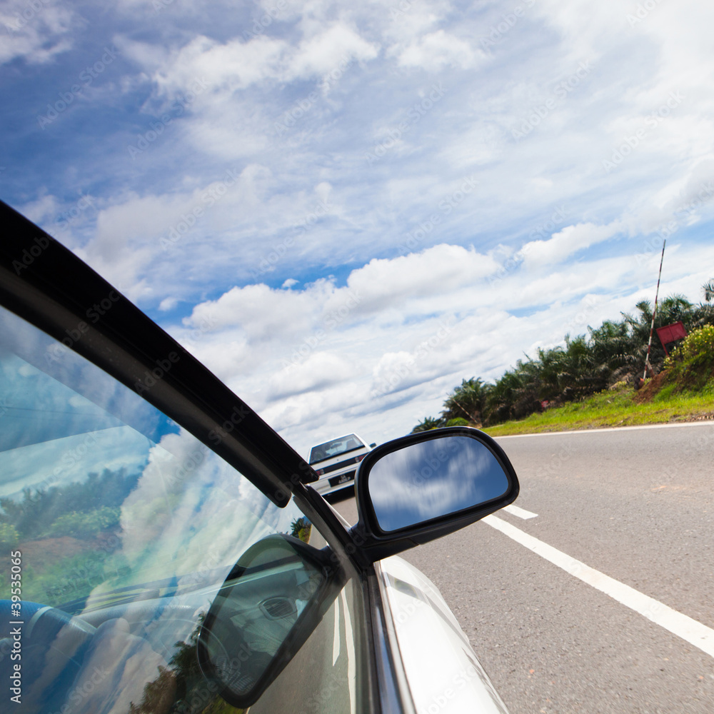 speed car driving at high speed on empty road - motion blur