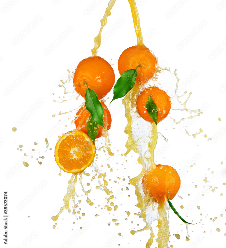 Fresh oranges in juice splash, isolated on white background