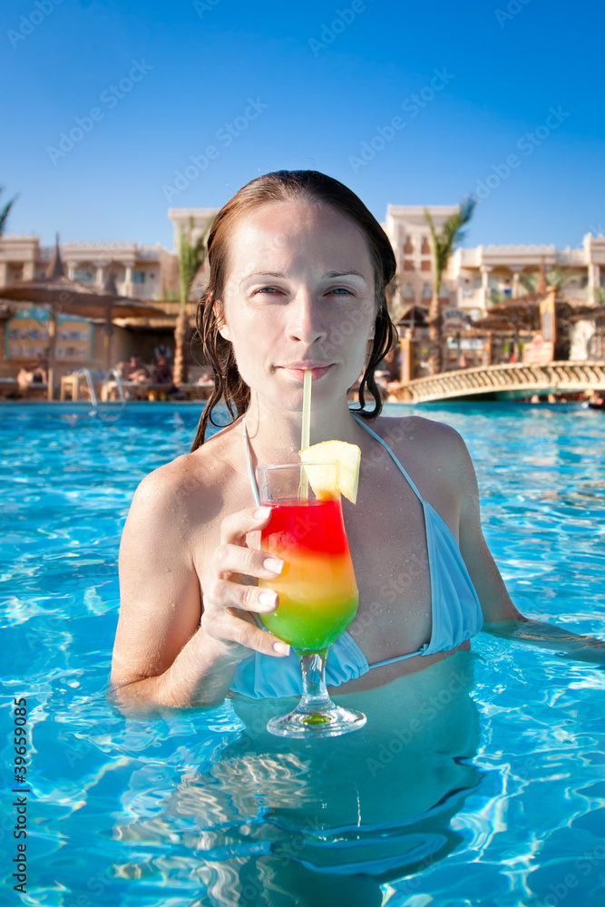 Woman drinking a fruit cocktail