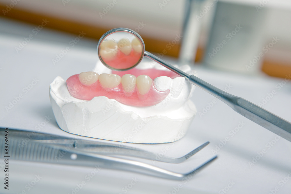 dentist tools with acrylic denture (False teeth)