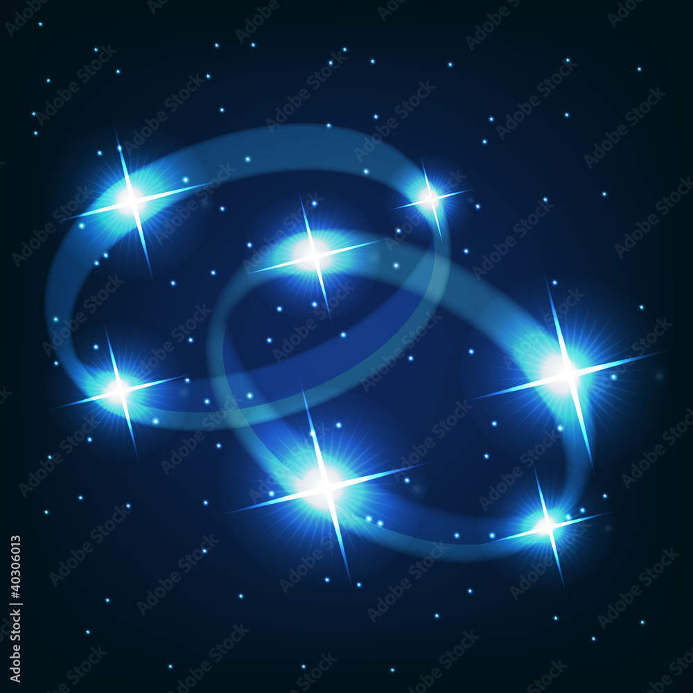 Two wedding rings beautiful bright stars on the background of co