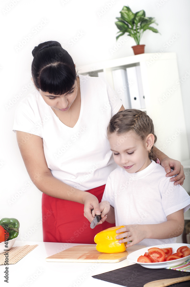 mom and daughter cooking together