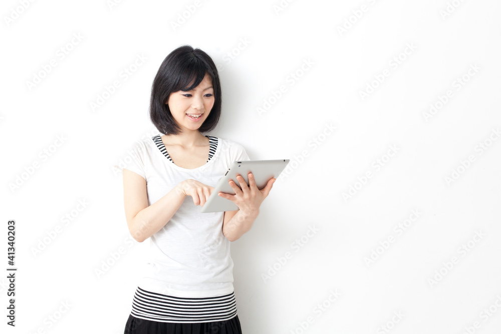 attractive asian woman using tablet computer