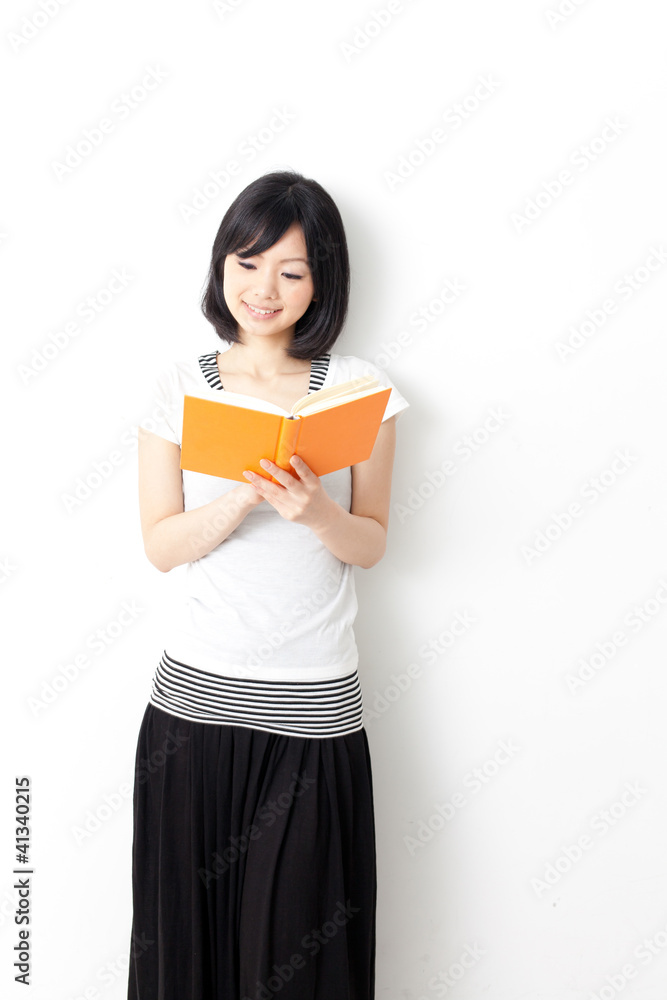 attractive asian woman reading book