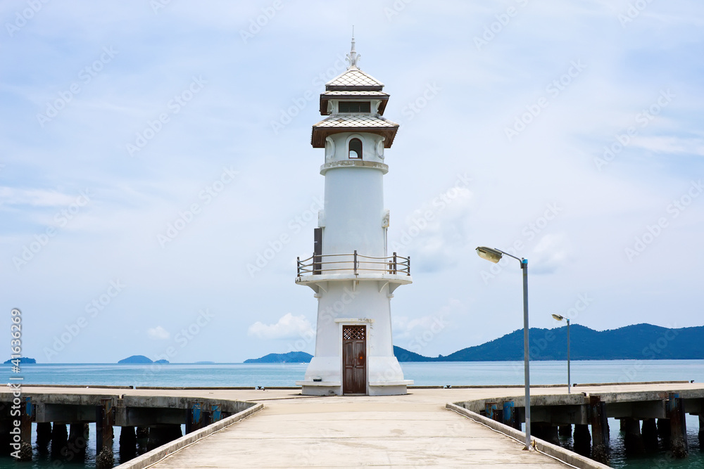 White lighthouse on jetty