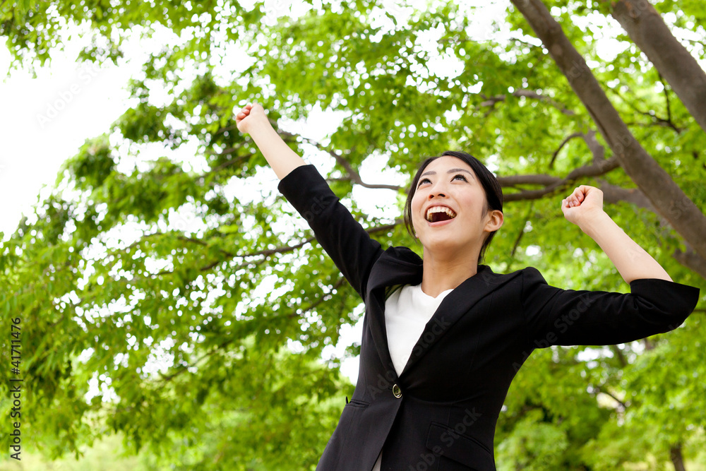 asian businesswoman relaxing in the park