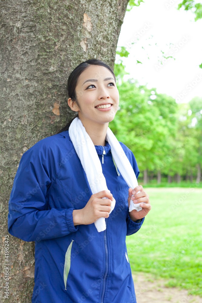 young asian woman relaxing in the park