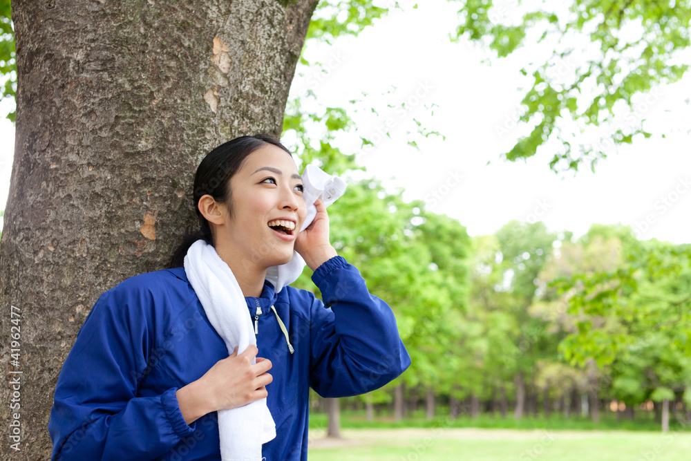 young asian woman relaxing in the park