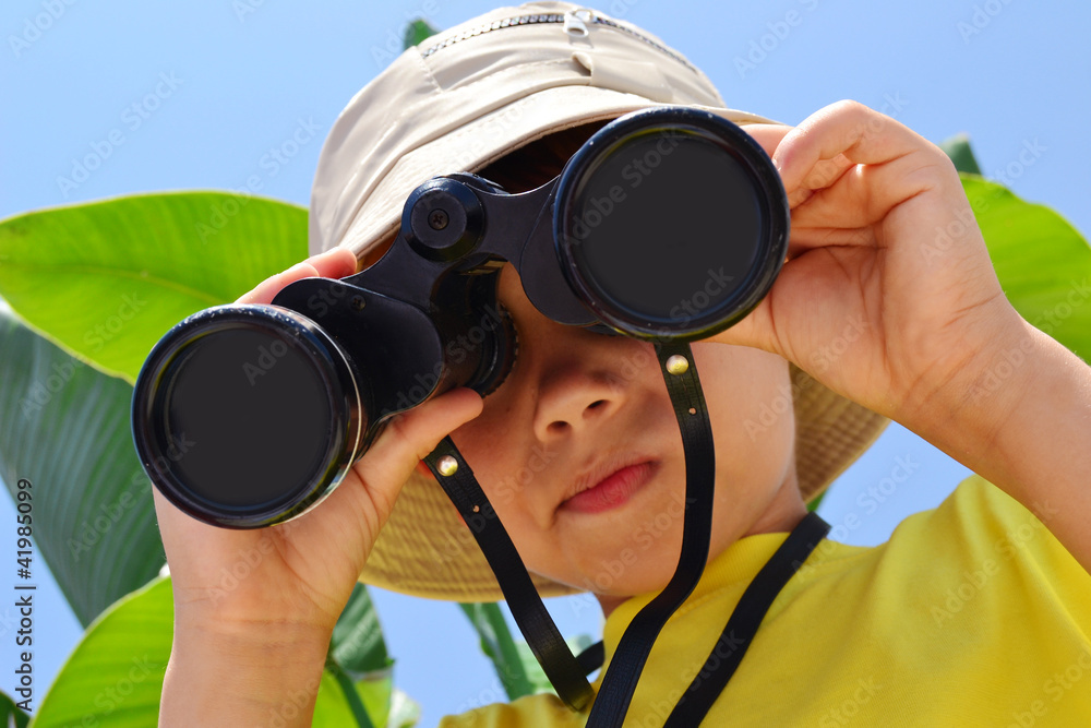 explorer boy with binoculars