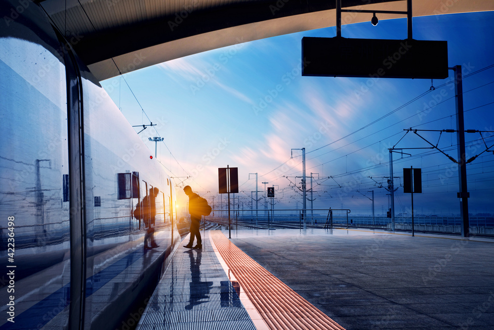 train stop at railway station with sunset