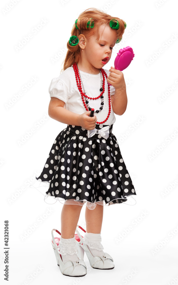 Little girl playing with makeup