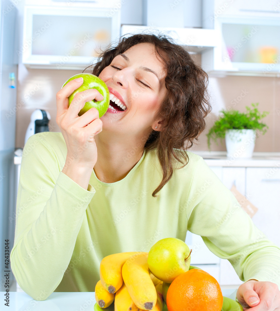 Dieting concept. Healthy Food. Young Woman Eats Fresh Fruit