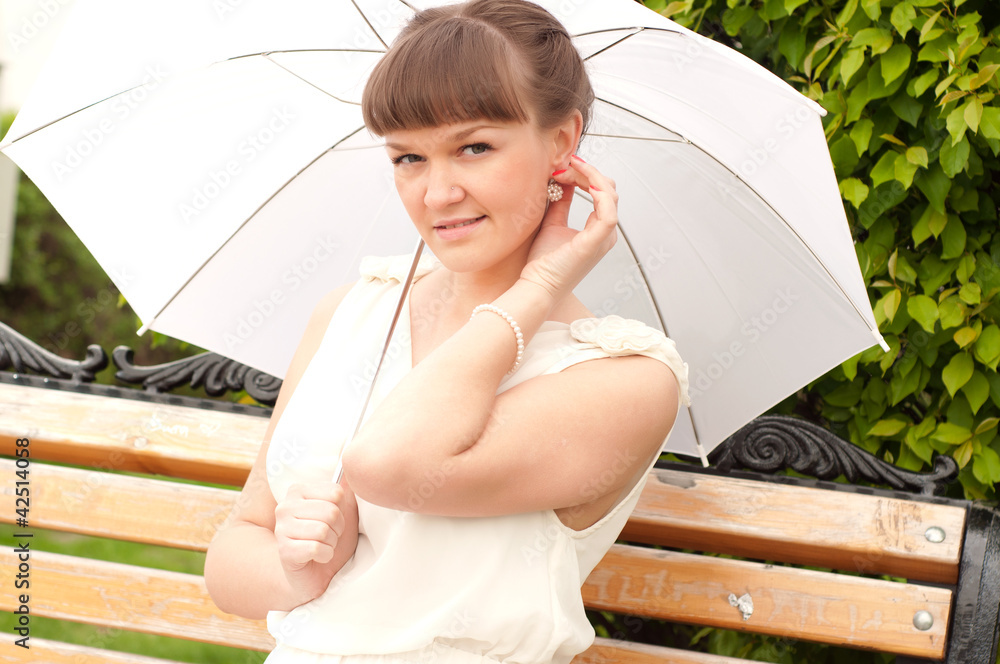 beautiful young woman under white umbrella