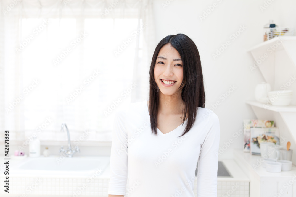 a young asian woman in the kitchen