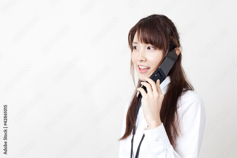 asian businesswoman talking by cellphone