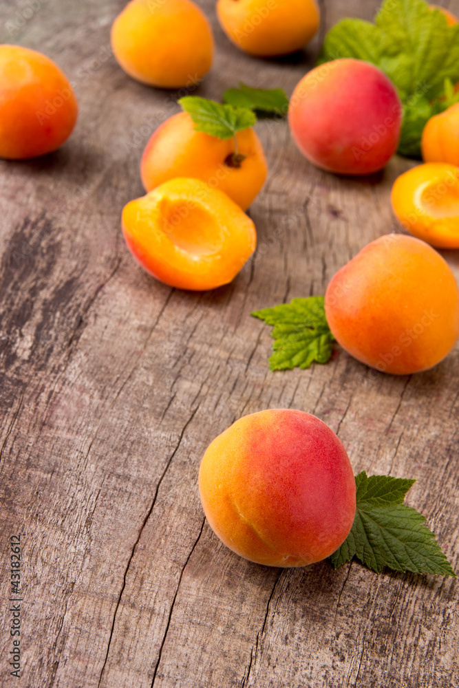 Fresh apricots on wooden table