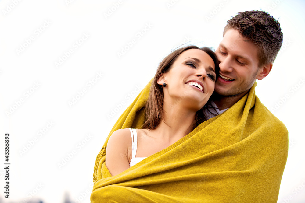 Romantic Couple with Blanket Laughing