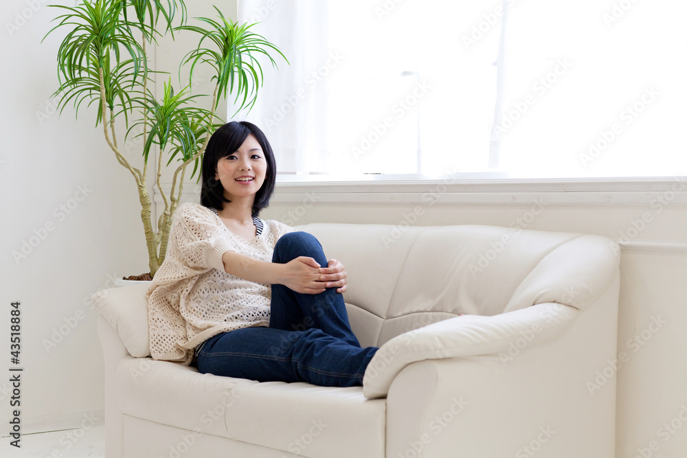 a young asian woman relaxing