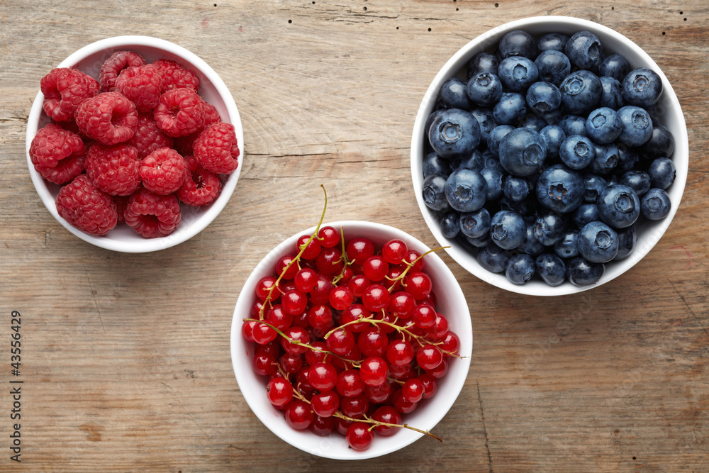 three bowls of berries