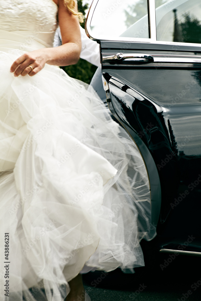 Bride stepping out of car