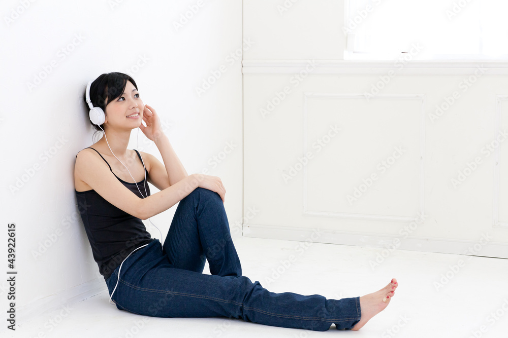 a young asian woman relaxing in the room